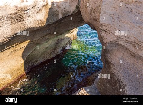 Coastal Stone Arch With Azure Clean Water Stock Photo Alamy