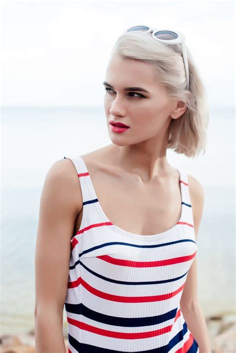 attractive blonde woman posing in retro striped swimsuit stock image image of retro style