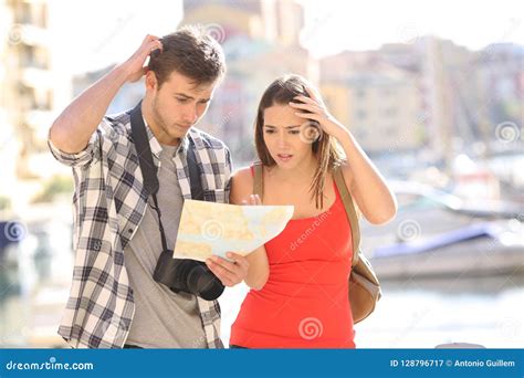 lost confused tourists looking at map on vacation stock image image of hotel customers 128796717