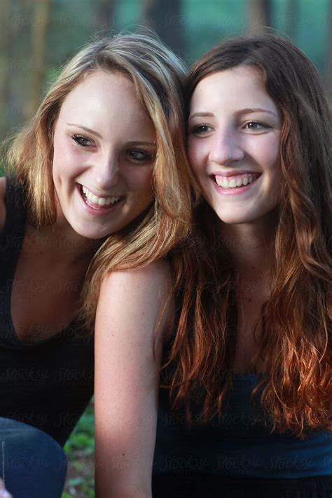 Two Beautiful Teen Girls Laughing Outdoors By Stocksy Contributor