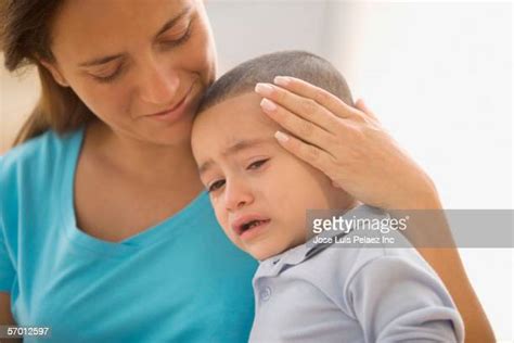 Mother Comforting Crying Child Photos And Premium High Res Pictures
