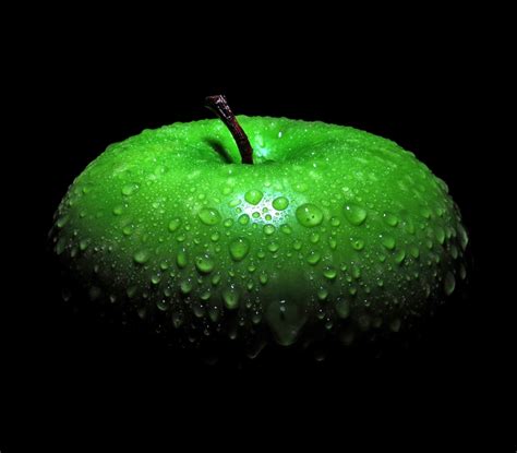 Was originated april 1976, steve jobs the vision statement shows the direction of the company's growth and product development. water droplets green apples apples black background ...