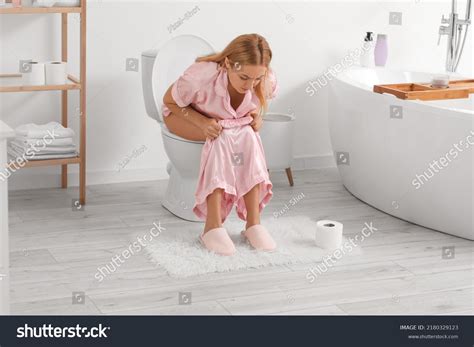 Mature Woman Diarrhea Sitting On Toilet Stock Photo