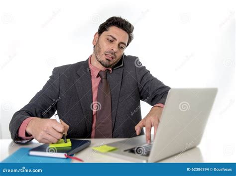 Busy Businessman Working In Stress On Computer Laptop Talking On Mobile