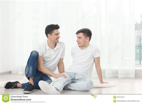Happy Gay Couple Sitting On Floor Window Stock Image Image Of Curtain Caucasian 105131621