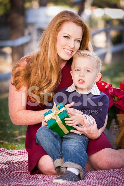 With mom in mind, we've collected some of our favorite wirecutter picks that happen to make good gifts, along with a few new ideas. Young Boy Holding Christmas Gift With His Mom IN Park ...