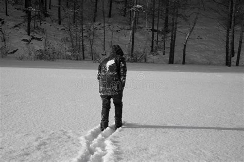A Lonely Man Walks In The Snow Dramatic Silhouette Of A Man Walking In