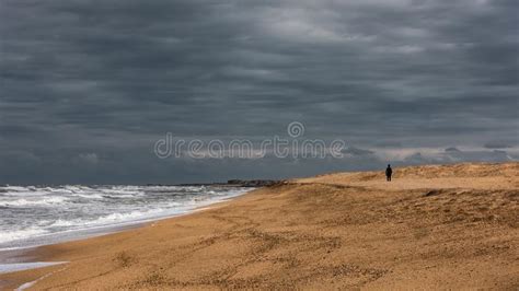 Lonely Man Walks Along The Sea Coast Stock Image Image Of Coastal