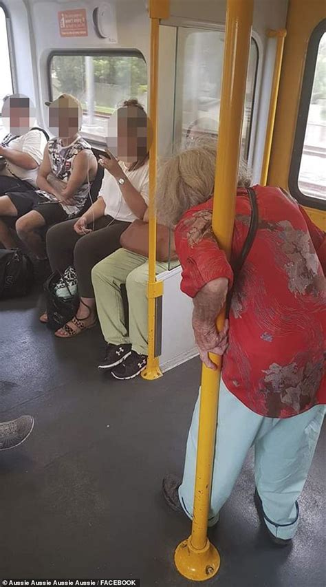 photo of an elderly woman stood hunched over on an australian train divides the internet daily