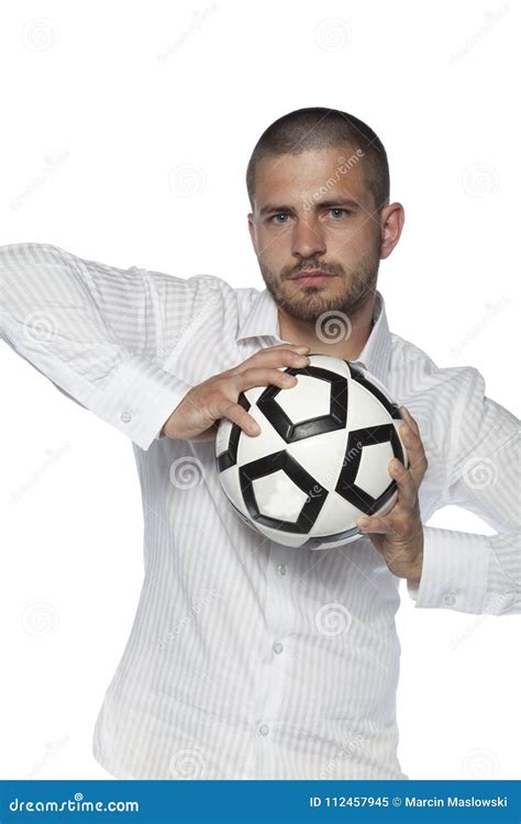 Businessman Holding The Ball Isolated On The White Background Stock