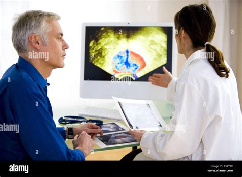 Doctor Discussing Prostate Ultrasound Scan With A Patient Stock Photo