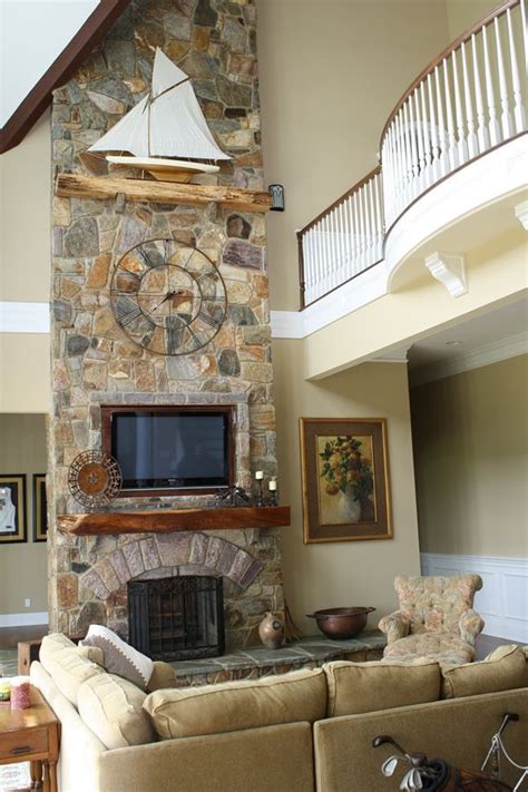 Great Room With The Fireplace As The Focal Point And Floor To Ceiling