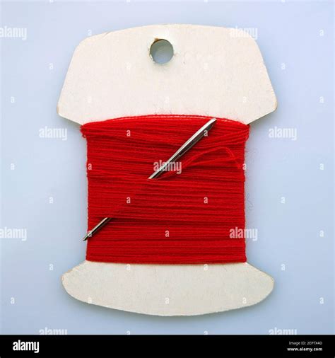 Red Sewing Thread And Needle Stock Photo Alamy