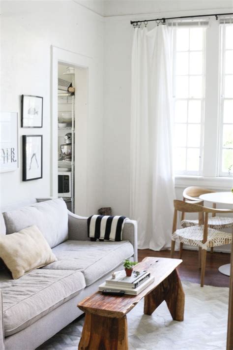A media console is a family room furniture must, but form without functionality is a waste of useful space. Small-Space Living in New Orleans' Garden District | Living room without coffee table, Small ...