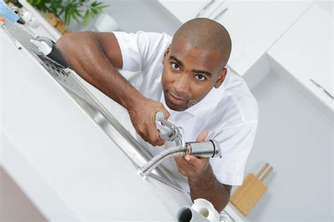 Plumber Fixing Sink In Kitchen Stock Photo Image Of Male Repairman