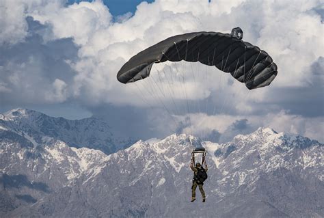 A Pararescueman Operates The Canopy Of His Parachute While Conducting A