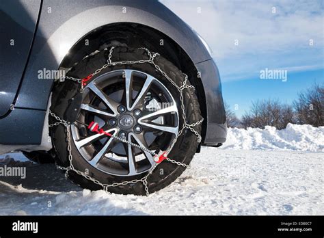Snow Chain Chains On Front Wheel Wheels Of A Car Also Fitted With