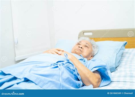 Senior Or Elderly Old Lady Woman Patient Lie Down In Nursing Hospital Ward Healthy Strong