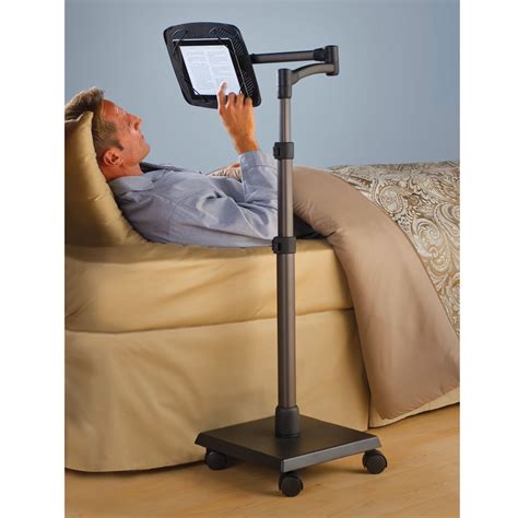 Side pockets in the arm rests can help store items like tv remotes or smartphones or even your favorite book. The Rolling Bedside iPad Stand - Hammacher Schlemmer