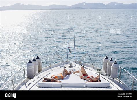 Women Sunbathing On Boat Deck High Resolution Stock Photography And