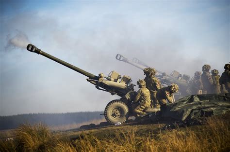 Soldiers Of The Royal Artillery Are Pictured Firing 105mm Light Guns