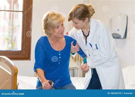 Nurse Helping Recovering Patient Stock Image Image Of Physical
