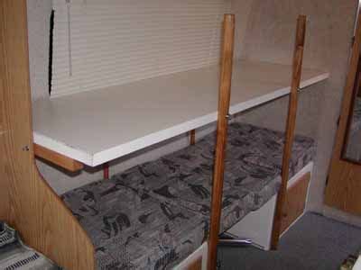 Make a couple dow rod pins that can be inserted through the plywood and into the wood base of the bed, so the ladder will not move back and forth. Bunk beds and sleeping 4 - The Casita Club Forum | Diy bunk bed, Camper bunk beds, Bunk beds