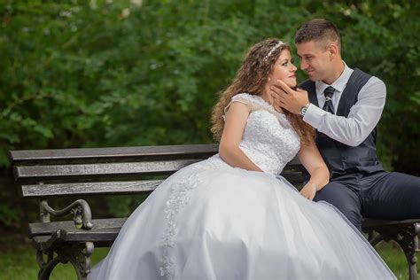 free picture kiss bride groom sitting bench engagement romance wedding couple love