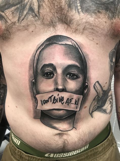 While the shirtless man's face is not visible, judging by the tattoos on display, fans are convinced nick is the father of her child! Eminem tattoo by colin Woolford | Eminem tattoo, Tattoos ...