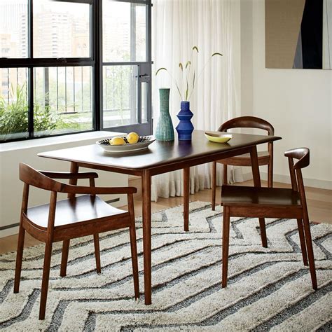A creative centerpiece on the dining table, however, can make your guests feel more welcome and set the scene for the atmosphere you'd like to have while entertaining your friends or family. Lena Mid-Century Dining Table | west elm UK