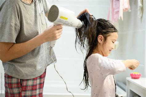 Mother Drying Daughters Hair By Stocksy Contributor Maahoo Stocksy