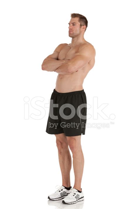 Muscular Man Standing With His Arms Crossed Stock Photo Royalty Free