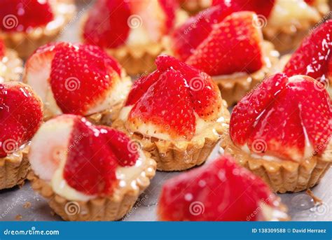 Close Up Of Delicious Tartlets With Fresh Strawberries And Vanilla