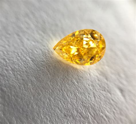 07 Carat Fancy Vivid Yellow Orange Diamond Pear Shape