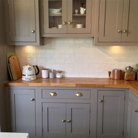 Kitchen worktops are surfaces designed to be used for many functions, such as a space to prepare food on or to place appliances on top of. Grey, country cottage kitchen with island and wooden ...
