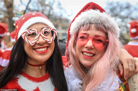 Hundreds Of Revellers Dress Up As Father Christmas As They Take Part In