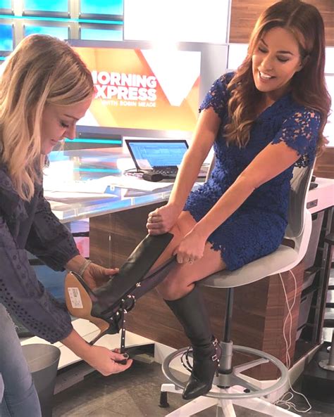 THE APPRECIATION OF NEWSWOMEN WEARING BOOTS BLOG ROBIN MEADE GETS HELP PUTTING HER BOOTS ON