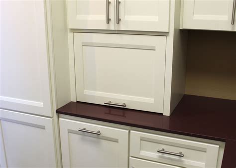 An appliance garage makes it easy to store these kitchen essentials behind closed doors. Appliance Storage - Burrows Cabinets - central Texas ...