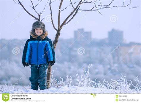Imagens licenciadas do nosso acervo. Funny Little Boy Standing Under The Tree Stock Photo ...