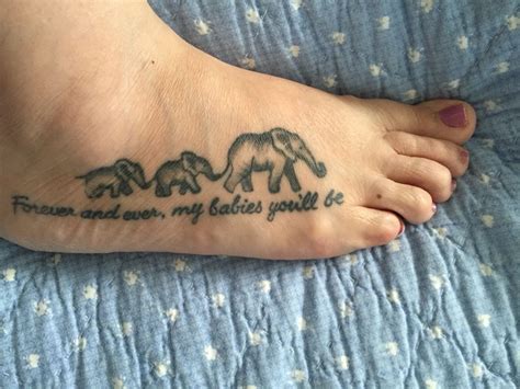 This is a polynesian elephant tattoo. Mother and babies elephant tattoo | Tattoos for daughters