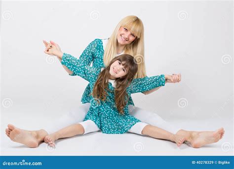 Mother And Daughter In Matching Outfit Having Fun Stock Image Image