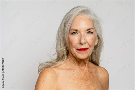 Mature Woman Poses With Bare Shoulders Stock Photo Adobe Stock