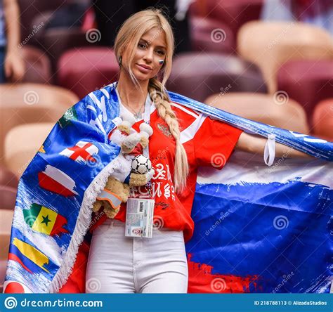 beautiful russian lady with russian flag and world cup mascot zabivaka before fifa world cup