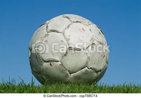 Dirty Old Soccer Ball On Grass Canstock