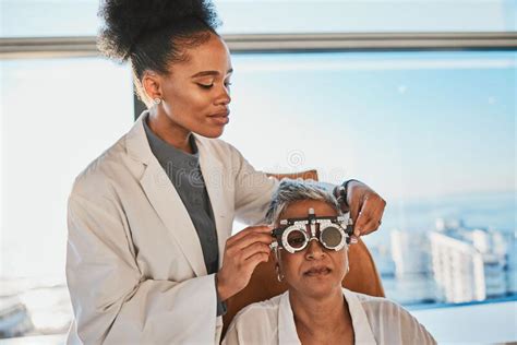 Senior Eye Exam Black Woman Doctor And Medical Eyes Test Of Elderly