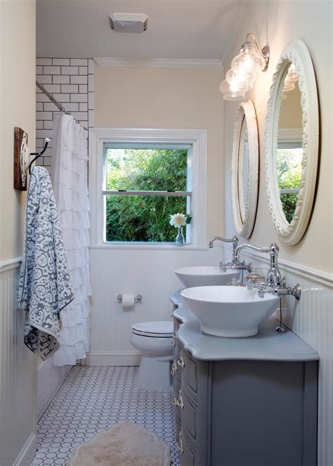 The brass mirror really stands out against the gray wallpaper while the two brown nickel and glass wall sconces tie it all together. Fixer Upper Bathroom Before & Afters - House of Hargrove
