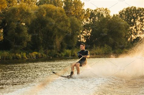 Man Water Skiing On Lake ~ Sports Photos ~ Creative Market