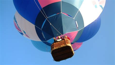2) when the air inside is a bit hotter, the balloon floats at a steady height because the lift force and weight are now the same. How it works - Hot Air Balloon Flights