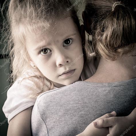 Sad Daughter Hugging His Mother Stock Photo By ©altanaka 35532253