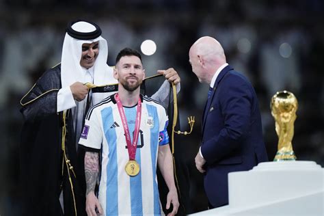 lionel messi wears arab robe during world cup trophy lift futbol on fannation